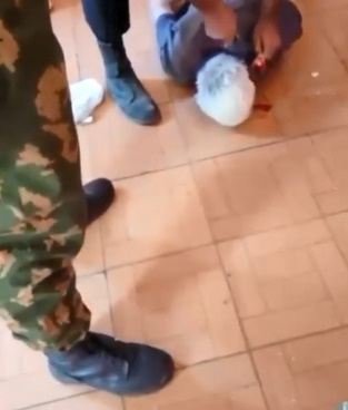 Azerbaijani Soldiers Cutting The Ears Off Of Two Armenians.