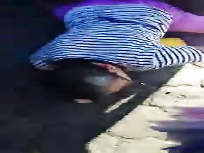 Onlookers Record An Elderly Woman Who Is Trapped Underneath Wheels