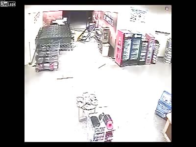 Truck crashes into gun store