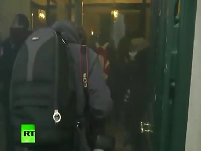 Parisian protesters emit tear gas