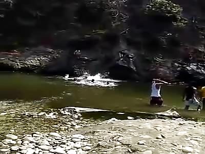 Man will jump off the top of a barrier on one side fell on a pile of stones