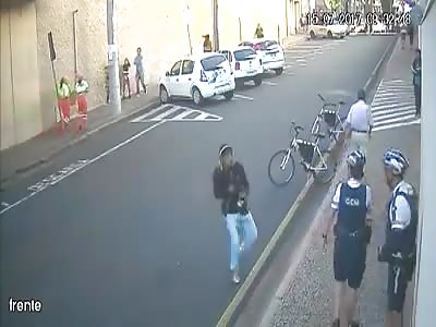 (another angle) cop take shots