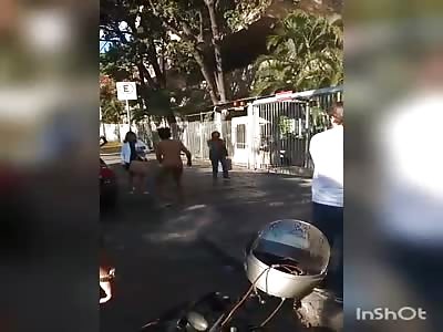 transvestite has a fit of nerves in front of a forum in brazil