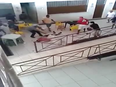 man brutally beating with helmets 