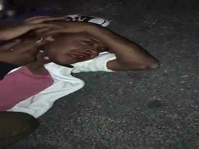 young man beaten with a gun