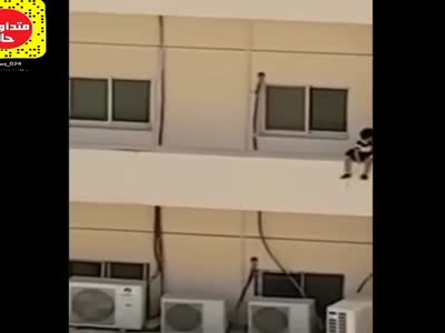 Little girl on the edge of the building is rescued.