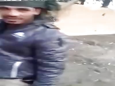 Tribal fighters loyal to Syrian Government show pile of dead ISIS Terrorists