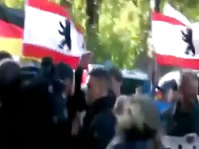 Berlin 03.10.2018 The Antifa throws bottles of water out the window