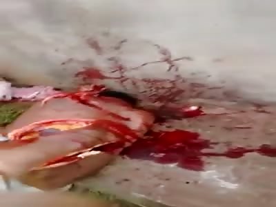 Mother crying over her chopped up son