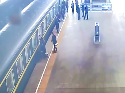 little girl fell into the train car bottom 