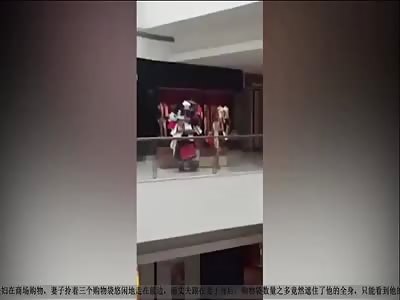 MAN CARRIES HE'S WIFE'S SHOPPING