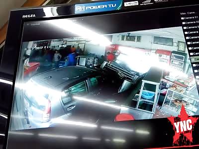 man drives his car into a restaurant