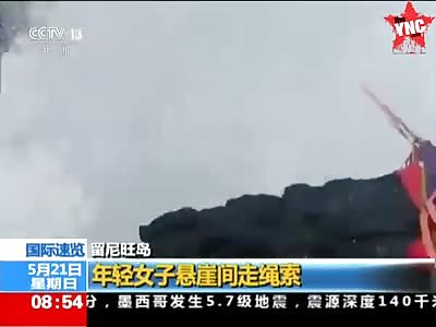 a woman  attempting to slackline across a 31-metre gap between two cliffs  nearly gets  washed away