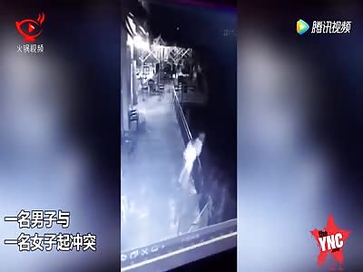 man throws his girlfriend of a building 