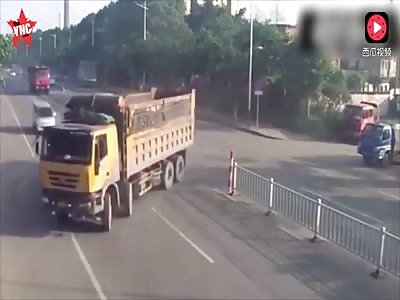 electric car driver crushed under a truck