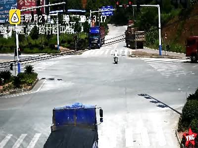 man gets crushed by a truck when he runs a red light 