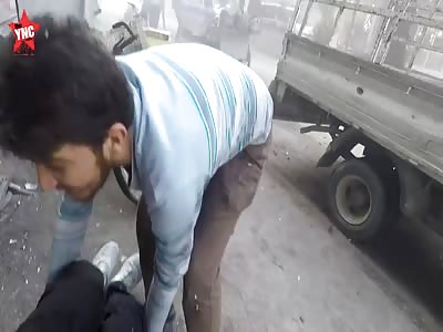 [high quality video ] of evacuation of the wounded after artillery bombardment in Hammouriyeh , Syria 