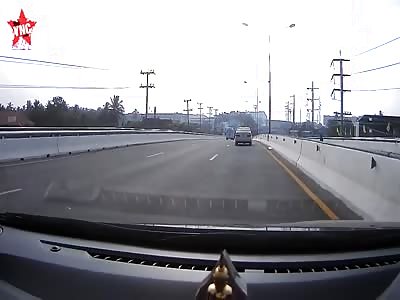 a pick up falls of a bridge onto moving traffic in Thailand @0:50 mark 