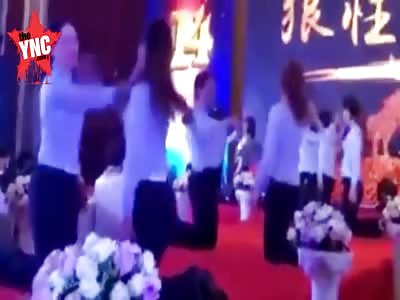 women at work  slap each other several times