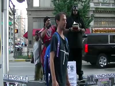 a white man gets punched in the face next to black racists 