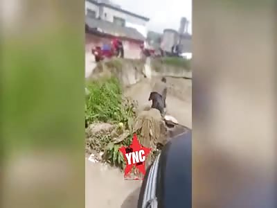 man beats his wife in the mud 