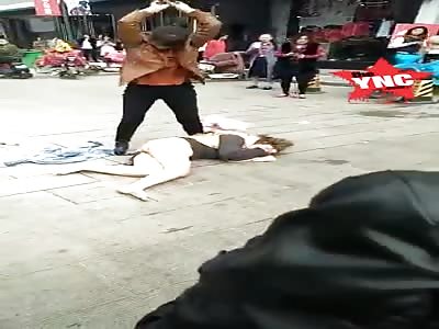 a husbands secret  lover is beaten in pubic view by his wife 