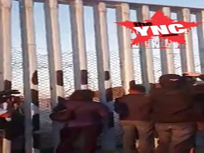 Honduran immigrants try to cross the USA border in Tijuana,Mexico
