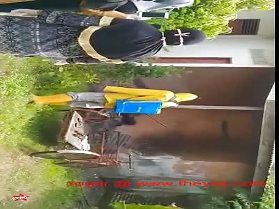 cleaning the rotting dead body filled with maggots in West Java