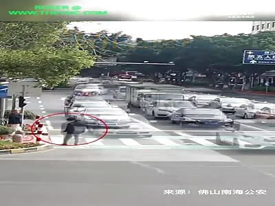 Con Artist gives him self a headache on the zebra crossing