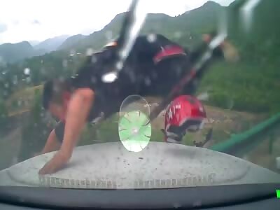 Cai on his motorcycle is rammed off a cliff in Chengxian.