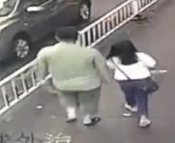 SUV Reverses and Run Overs a Female Pedestrian