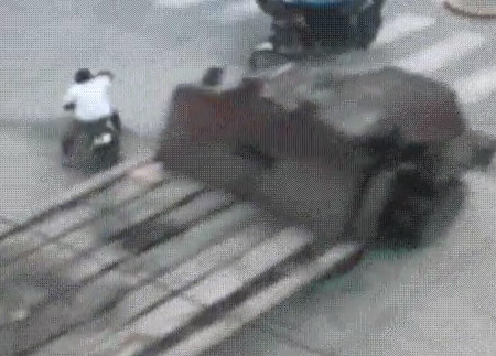 Woman on a Scooter Killed by Truck