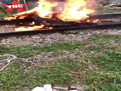 Flaming corpse found on the train tracks