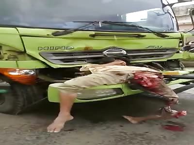  Dead man stuck to the front of a truck and another crushed on the road