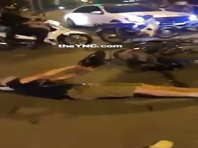 Motorcyclist having a seizure while everyone just watches