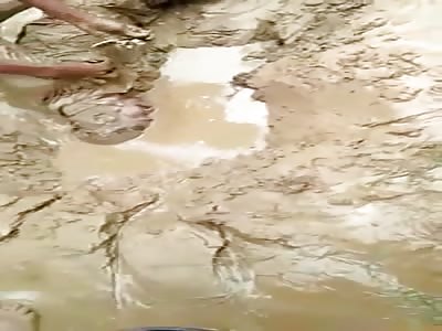 Man died buried alive in mud during a flood