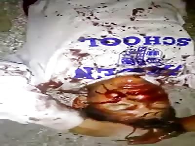 Thief covered in blood after being beaten by mob