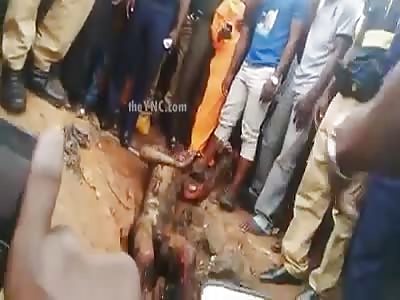 Another angle of burned thug in agony before being killed