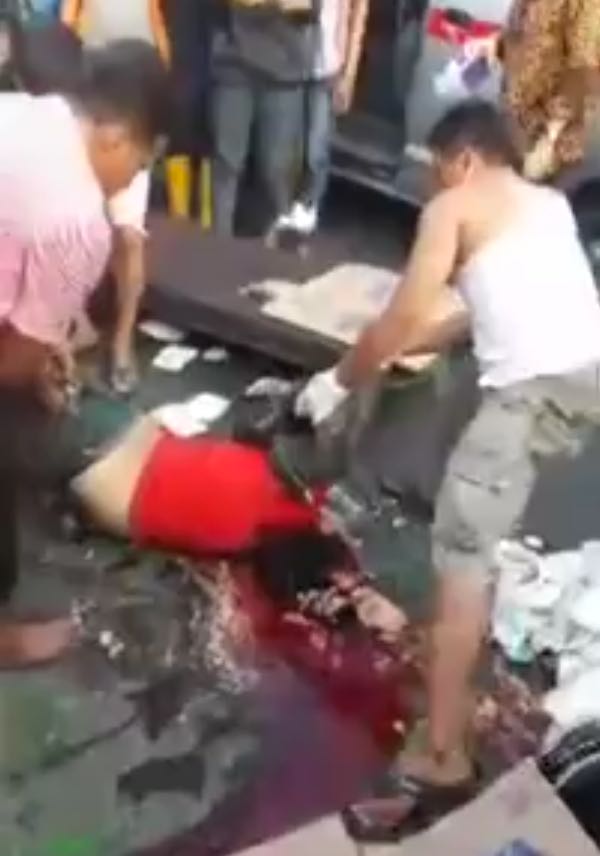 Biker With Head Split Wide Open and Brains Out is Loaded onto Stretcher