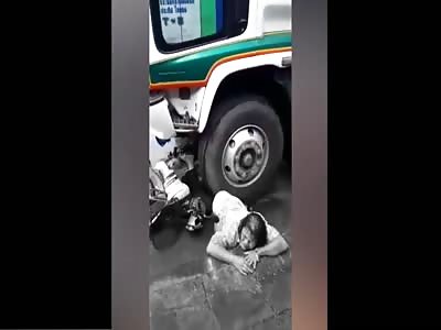 Alive Biker Agonizing Under Trucks Wheel As it is Removed
