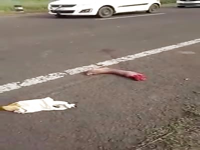 Biker Agonizing with Foot Left on The Road