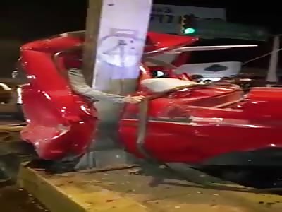 Driver Crushed Against Post