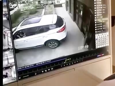 Car Reverses into Kid