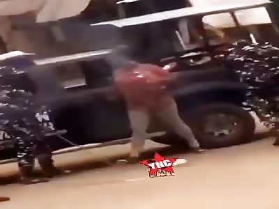 Nigerian police ruthlessly spank woman for sitting outside her home