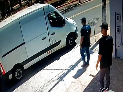 hitman executes his victim on top of his truck