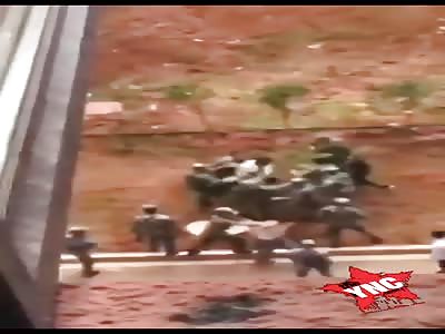 the student receives a beating by the soldiers