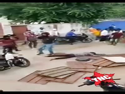 young man hitting a car driver