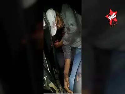 Two men were massacred inside his car