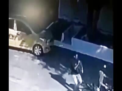 Hitman unloads his weapon against the taxi