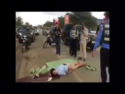 Man crushed in the middle of the road